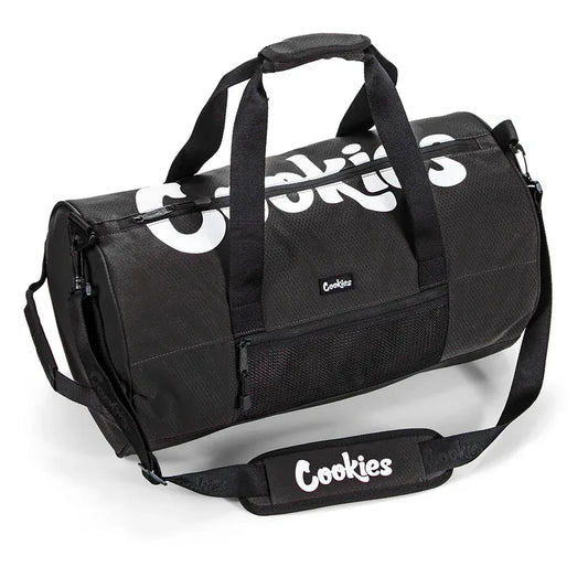 Black ripstop duffle bag with white "Cookies" logo text and a mesh front pocket. Features dual carry handles and a detachable shoulder strap.