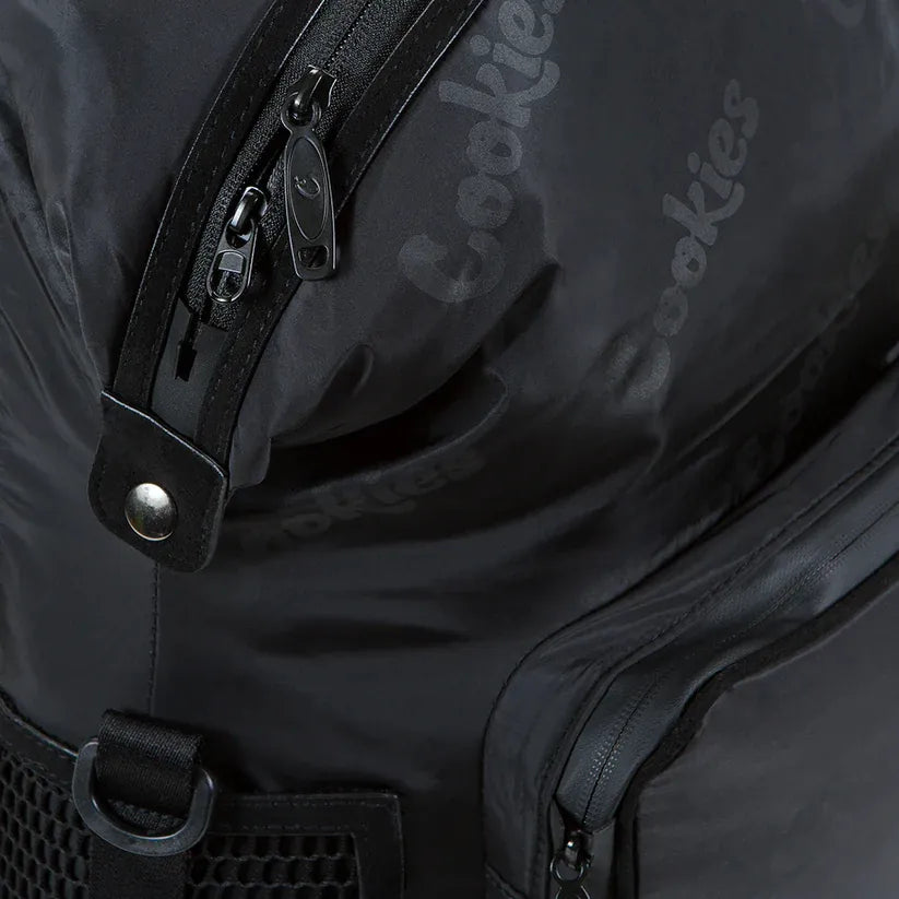 Black satin "Smell Proof" backpack with "Cookies" logo embossed on the fabric and multiple zippered compartments.