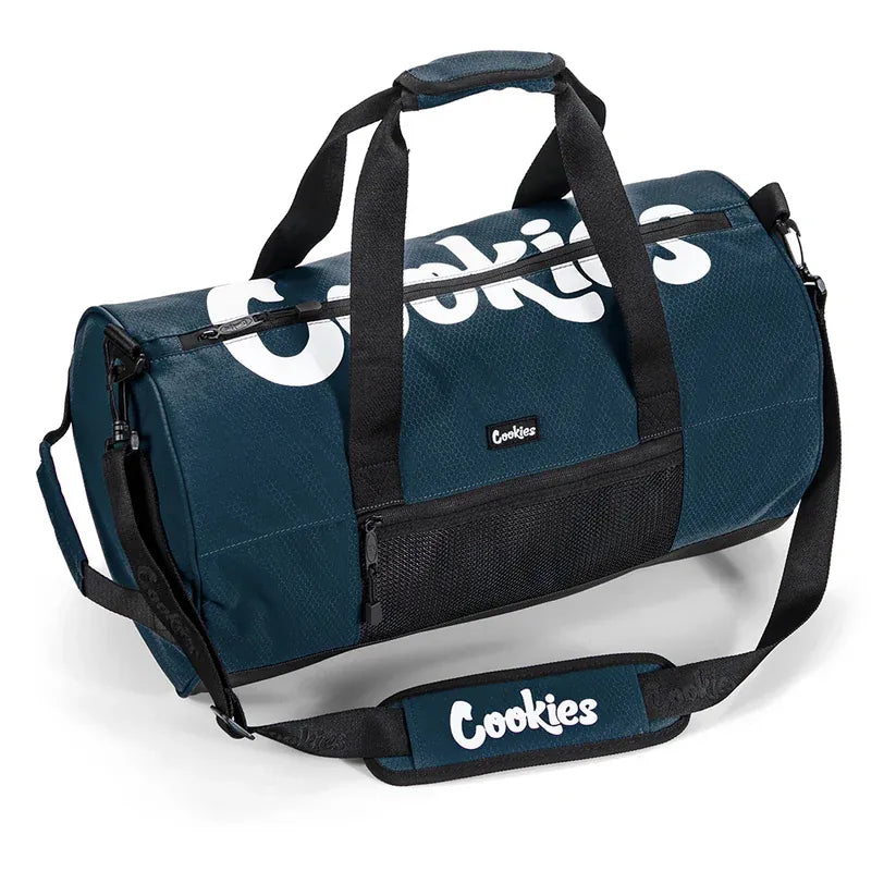 Dark teal ripstop duffle bag with white "Cookies" logo on the side and front. Features padded handles, adjustable shoulder strap, front zip pocket, and mesh side pocket.