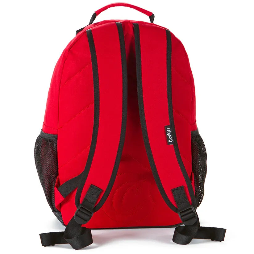 Red Stasher smell proof backpack with black trim and mesh side pockets. Features padded shoulder straps and a top handle.
