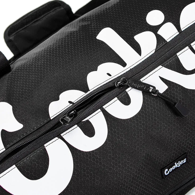 Black ripstop duffle bag with large white "Cookies" logo and zippered compartment.