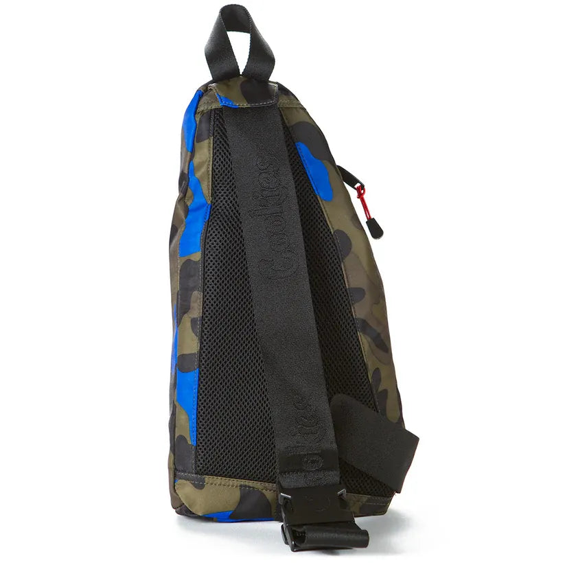 Camouflage print sling bag with blue accents, black mesh back panel, and adjustable strap with buckle. Features a red zipper pull.